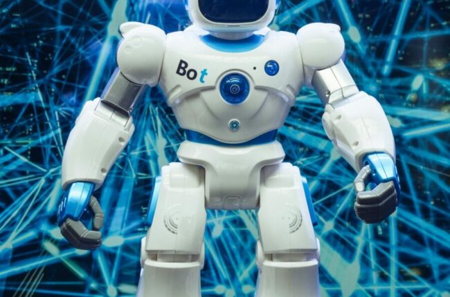 Futuristic humanoid robot against a blue network pattern backdrop, showcasing modern technology.